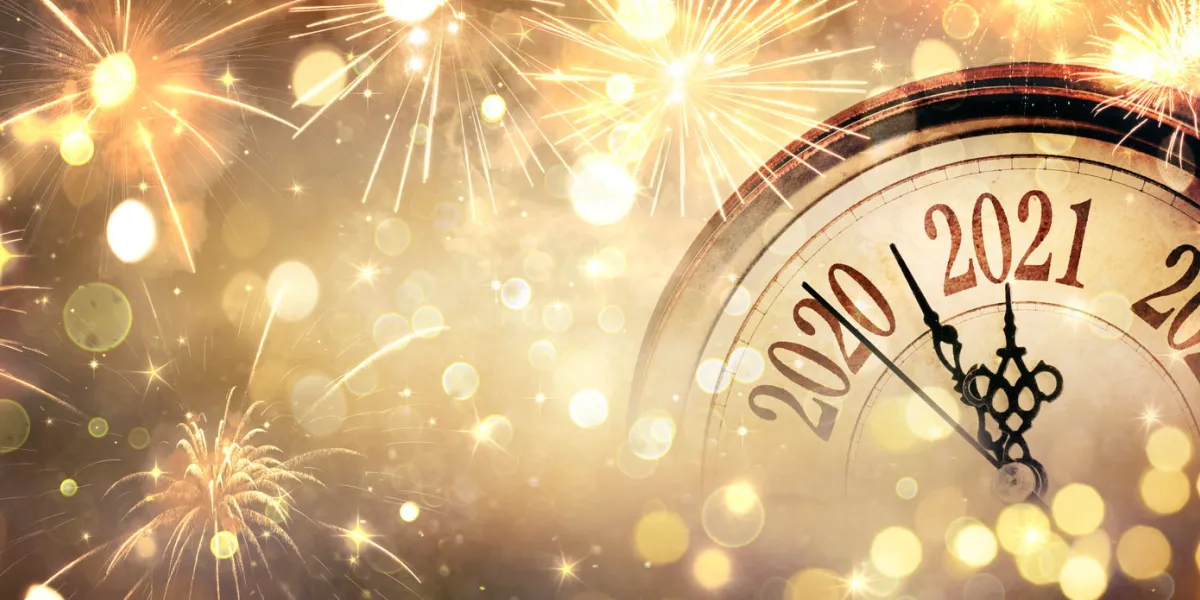 countdown to midnight - happy new year 2021 - abstract defocused background - clock and fireworks