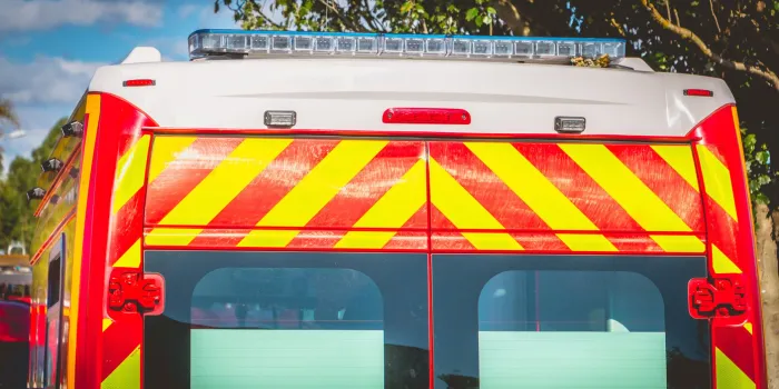 blue flashing light on a red ambulance firefighters
