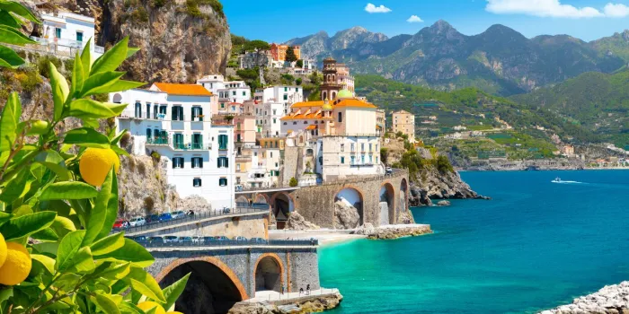 beautiful view of amalfi on the mediterranean coast with lemons in the foreground, italy
