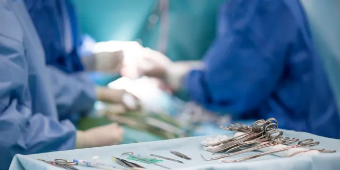 sterile surgical instruments on during the operation table amid the surgeons