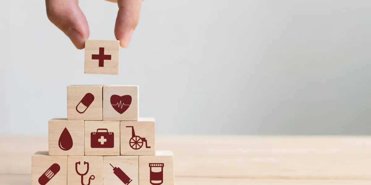 hand arranging wood block stacking with icon healthcare medical, insurance for your health concept