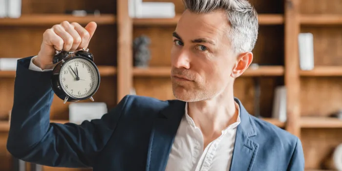 deadline caucasian mature middle-aged businessman boss ceo employee freelancer holding watch clock showing time, high time for start-up in office