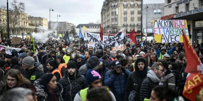 protesters take part in a demonstration near gare de l'est train station in paris on december 26, 2019, as part of a nationwide multi-sector strike against french government's pensions overhaul (photo by stephane de sakutin   afp)