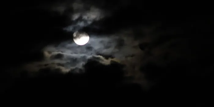 bright moon, dark clouds