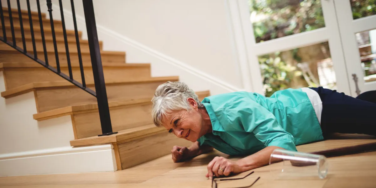 senior woman fallen down from stairs at home