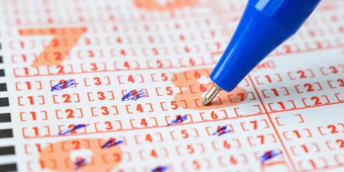 lottery ticket and pen close-up, selective focus