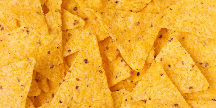 classic mexican snack - nachos background, top view