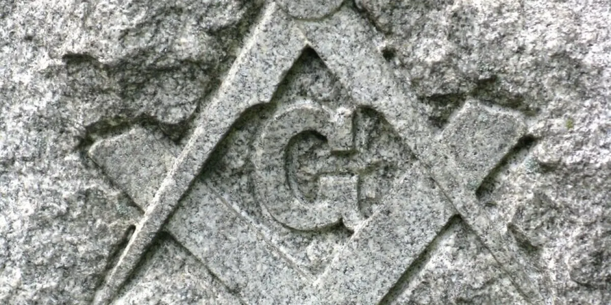 the symbol of the freemasons, carved into stone