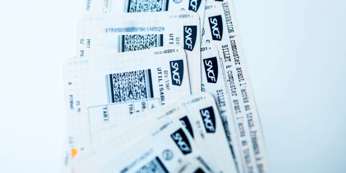 paris, france - january 14, 2015  train tickets for sncf - societe nationale des chemins de fer francais or national society of french railways on white bakground for mutiple destinations on tgv