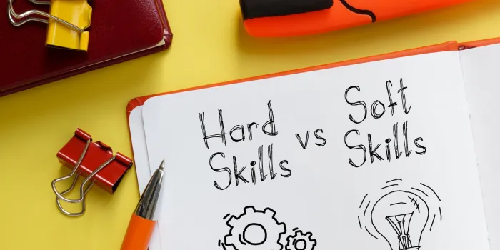 hard skills vs soft skills are shown on the business photo using the text