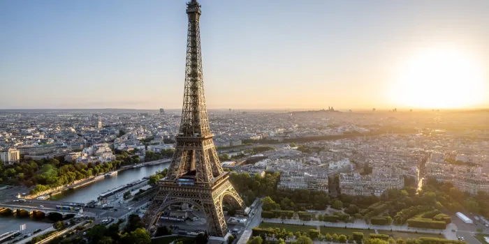 aerial view of paris, france, overlooking the famous eiffel tower, sunrise in the background