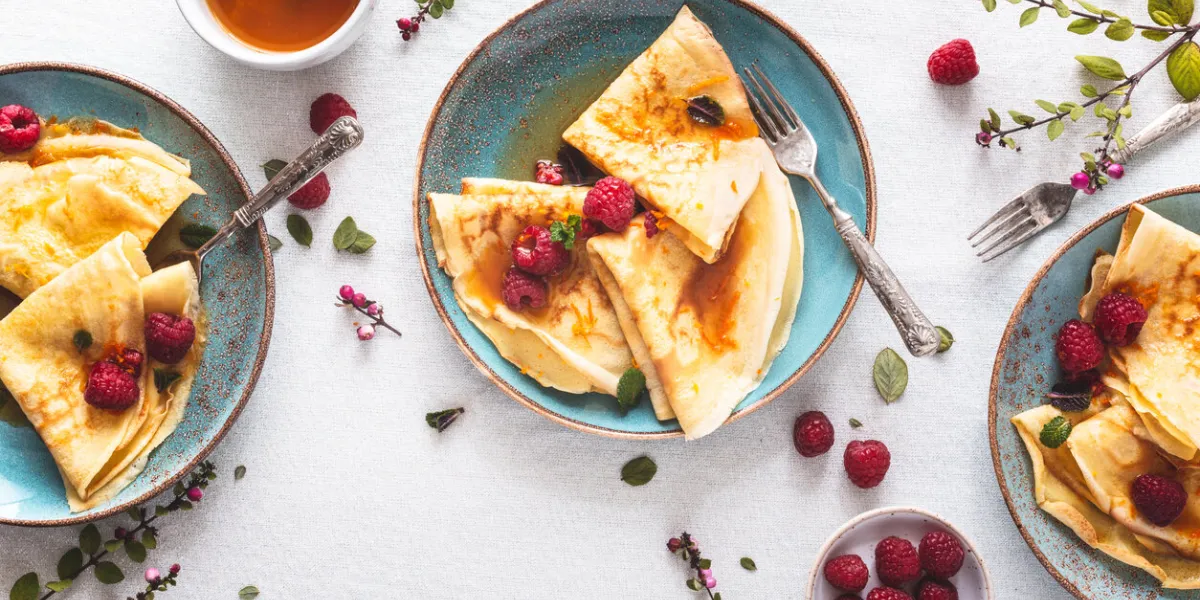 pancake suzette citrus sauce and rum and raspberries for candlemas