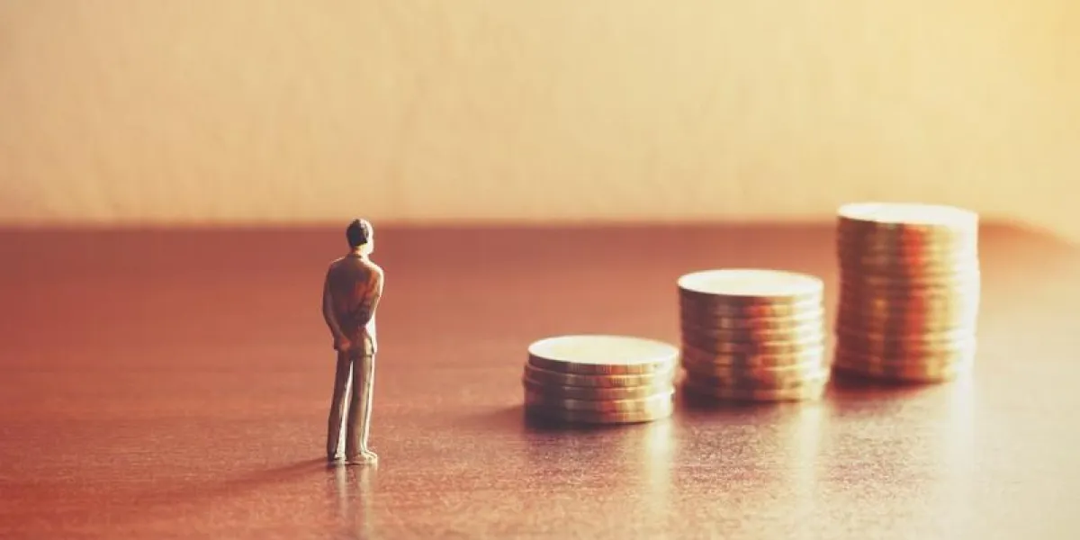 miniature people looking future with stack coin about financial and money savings concept