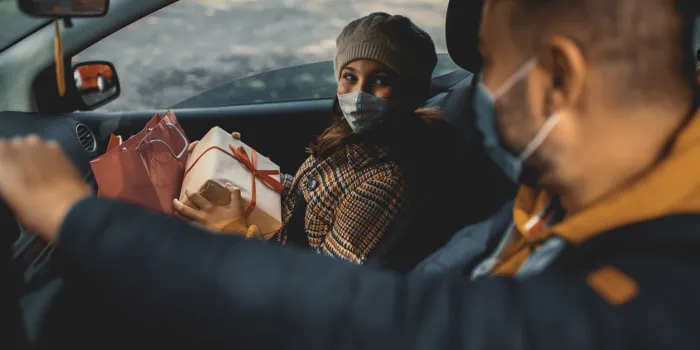 family shopping christmas gifts during covid-19 pandemic they wears a protective mask to protect from coronavirus