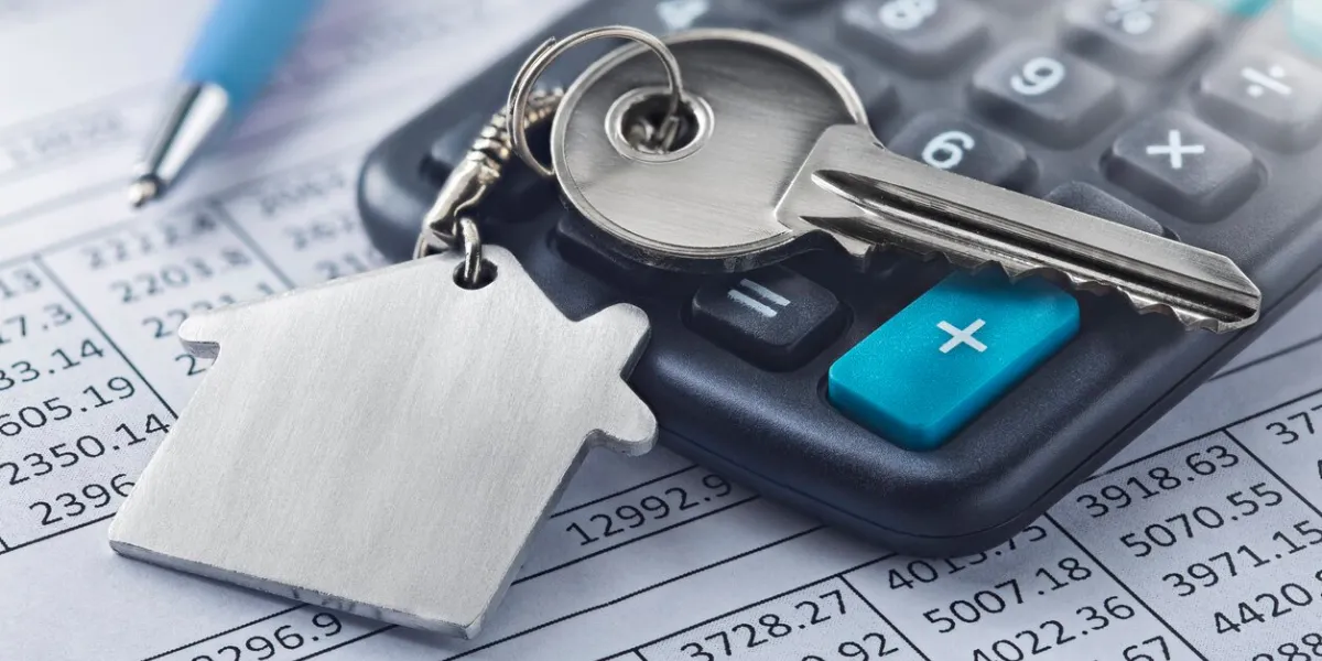 real estate, keychain with house symbol key with finance blank