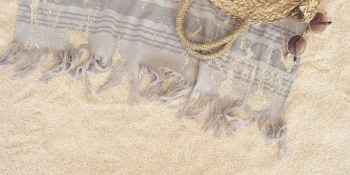 beach towel on sandy floor