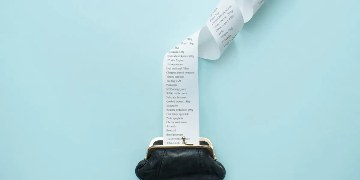large receipt coming out of purse, inflation, food rising costs concept