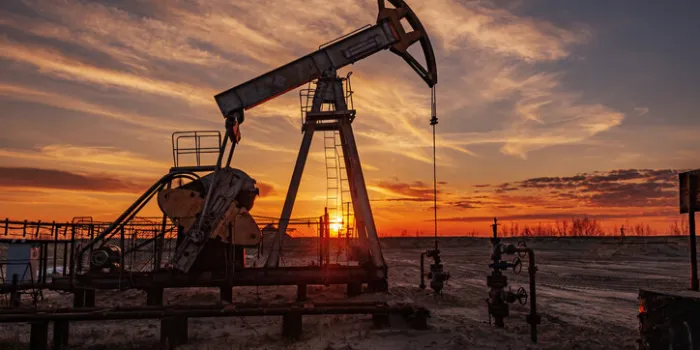 oil pump rig oil and gas production oilfield site pump jack are running drilling derricks for fossil fuels output and crude oil production war on oil prices global coronavirus covid 19 crisis