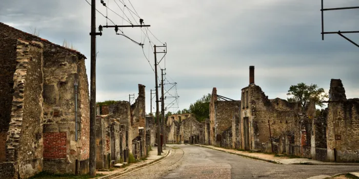 the village of oradour sur glane, france was destroyed in 1944, when its inhabitants were massacred by german nazi a new village was built nearby, the original was preserved as a permanent memorial
