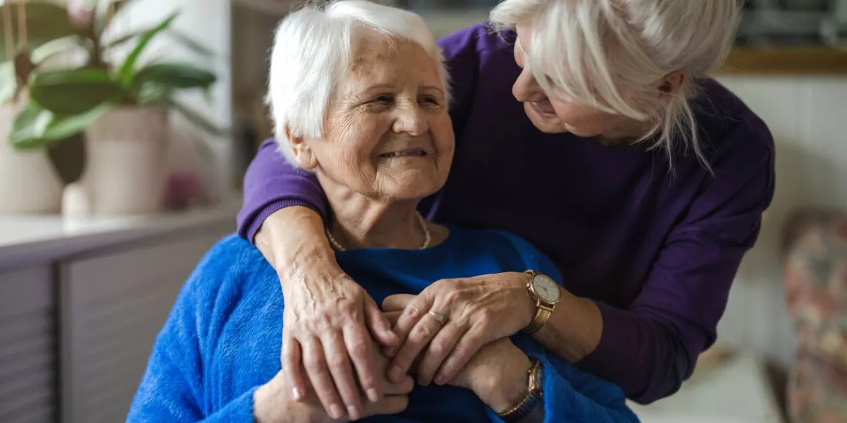 woman hugging her elderly mother