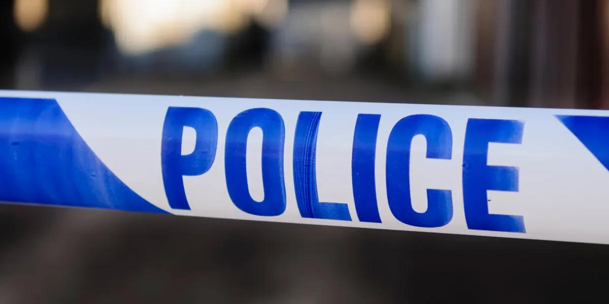 police tape at the cordon across a crime scene