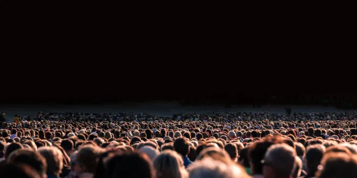 panoramic photo of large crowd of people slow shutter speed motion blur