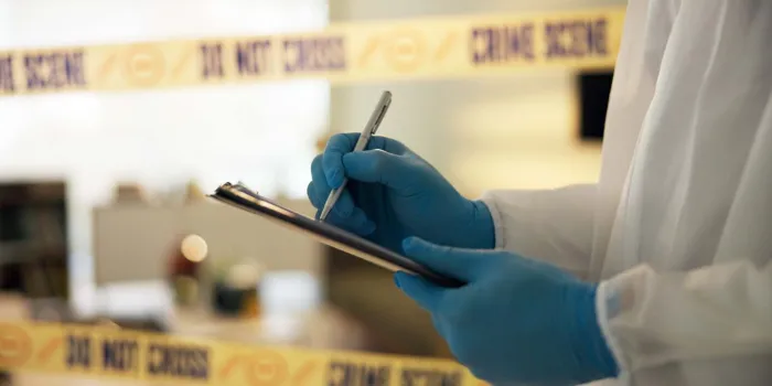 hand, house and crime scene with writing for evidence or notes in robbery for evidence, safety and report forensics, police tape and investigation at home for dna, analysis and criminal activity