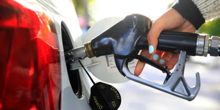 close-up of a person refueling diesel at a petrol station
