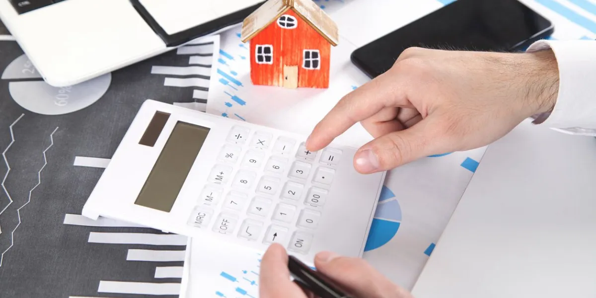 man calculating house loan of finance and investment for real estate