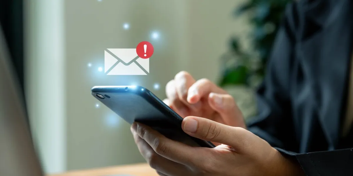 security concept, businesswoman using phone with email danger alert