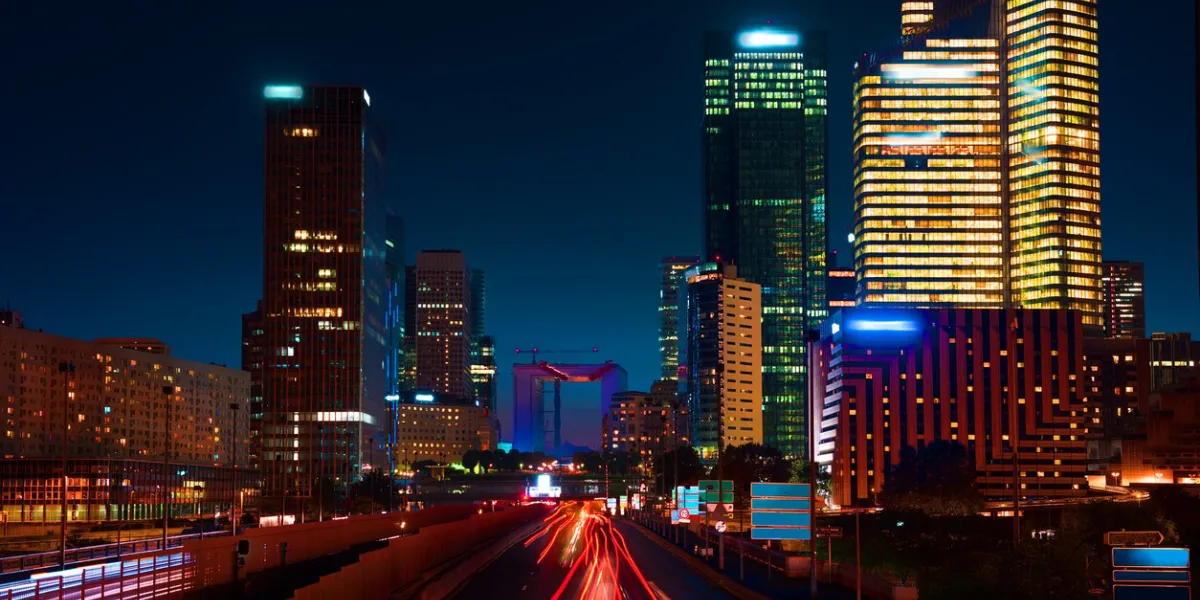 road to skyscrapers of parisian district la defense at night, france