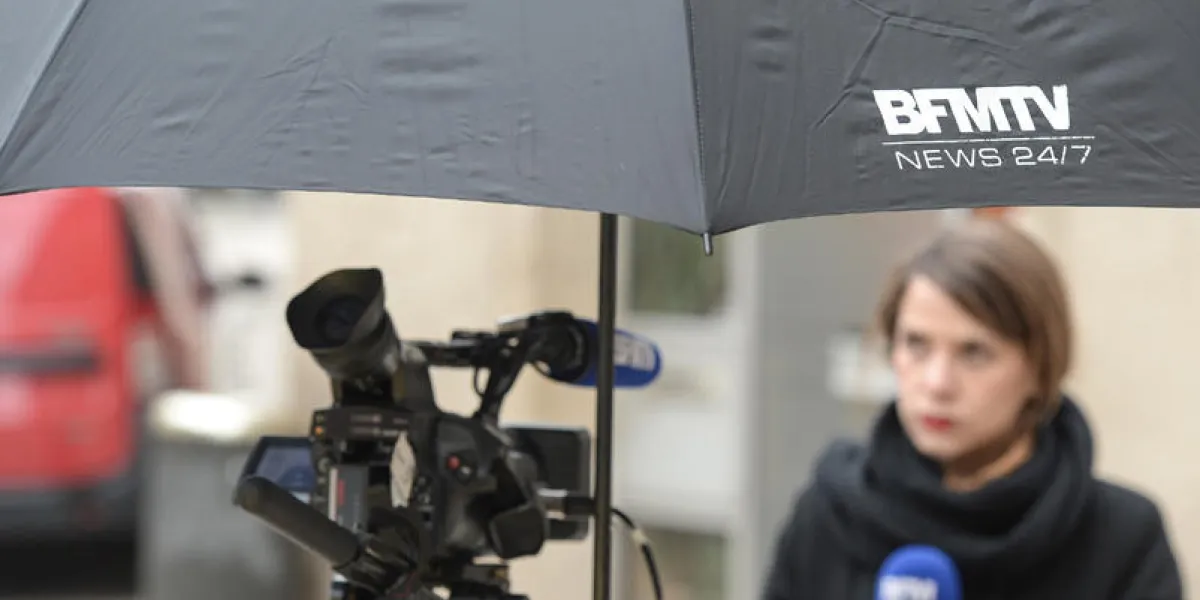 a bfmtv's journalist waits for a broadcast on january 31, 2018 ,in vesoul (photo by sebastien bozon   afp)