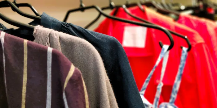 ladies clothing on hanger at the modern shop boutique - stock photo
