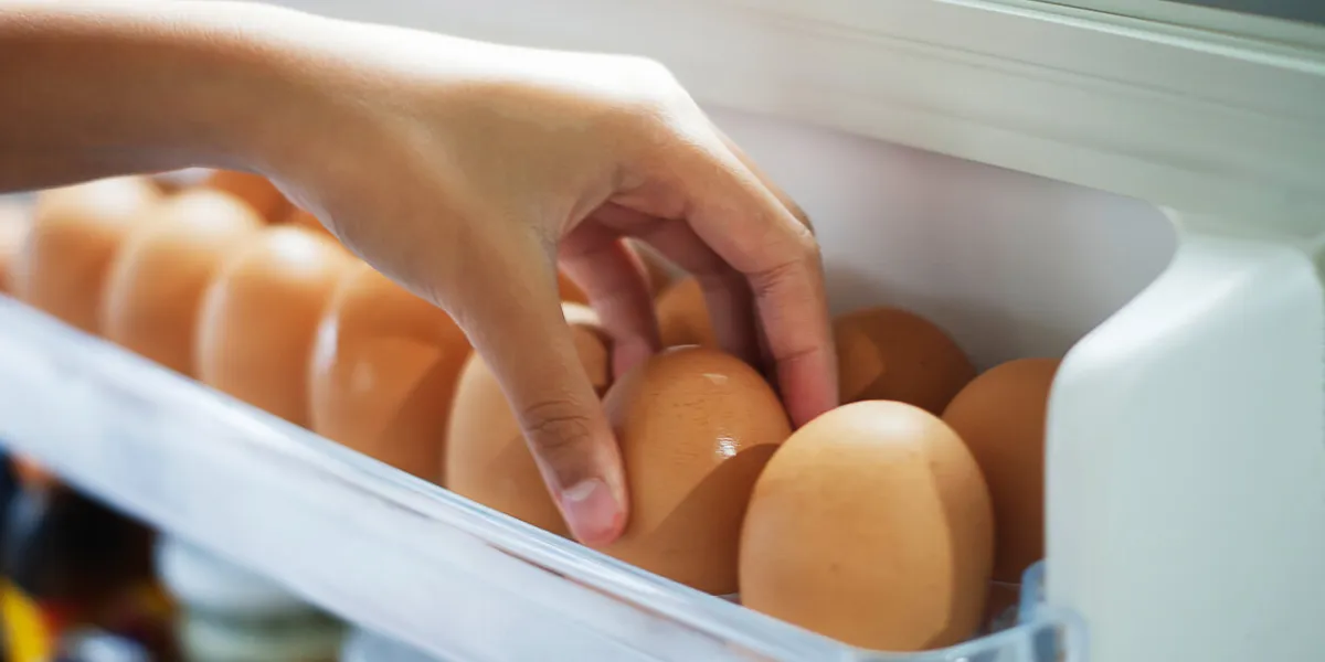 pick chicken eggs from the refrigerator, eggs on shelf of refrigerator