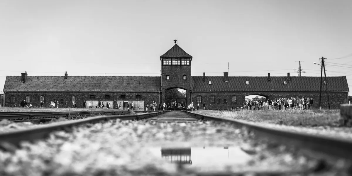 rail entrance to concentration camp at auschwitz birkenau kz poland,classic historical view of auschwitz death camp in black and white,part of auschwitz concentration camp