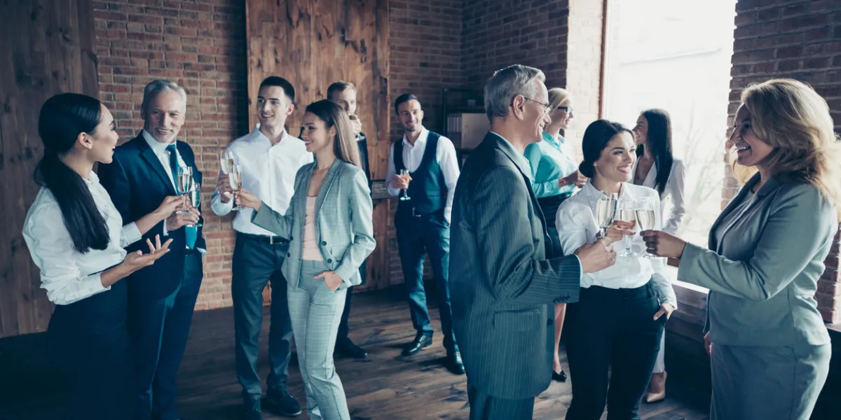 close up photo business people different age race free leisure excited team building members gathering she her he him his golden beverage toasting best brigade friendship formal wear jackets shirts