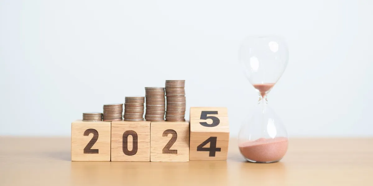 2024 end year to happy new year 2025 with hourglass and coins stack arrangement money saving for future plan, retirement fund, pension, investment, wealth business, financial and countdown concepts