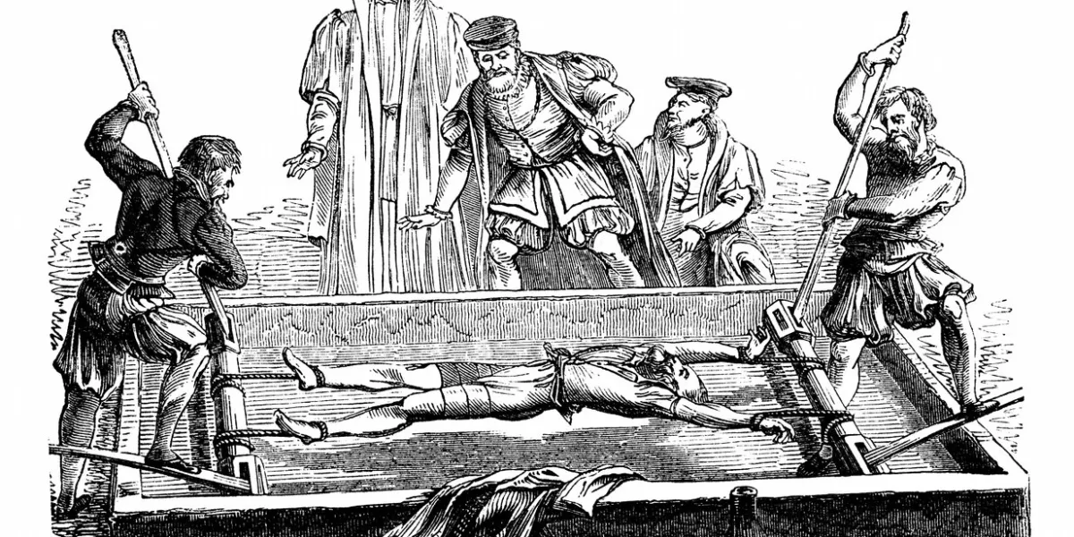 an engraved illustration image of a victim being tortured on a medieval middle ages rack in england, uk, from a victorian book dated 1868 that is no longer in copyright