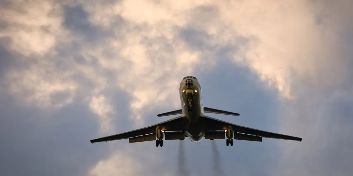 plane in the evening sky