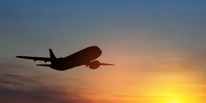 airplane taking off at the sunset sky silhouette of aircraft in the sky