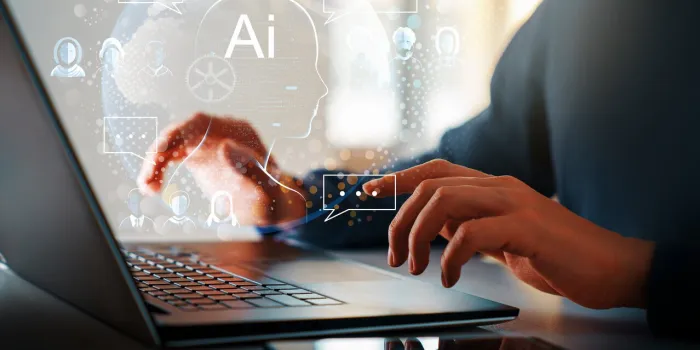 computer and hands close up the concept of artificial intelligence and computer technology