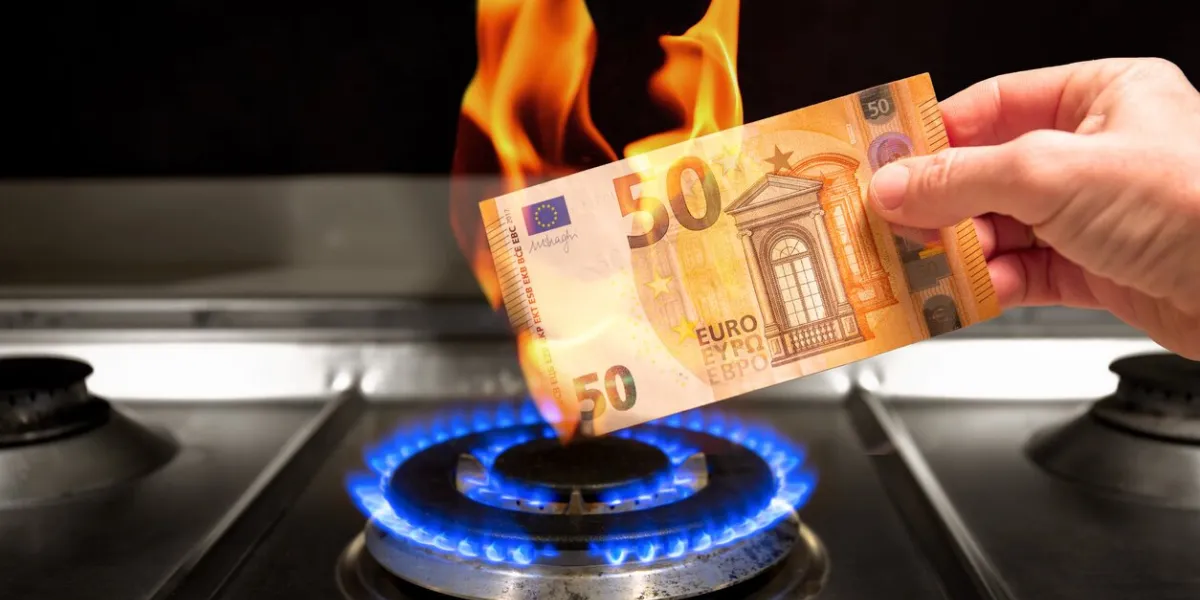 a man burns a 50 euro banknote over a gas flame while holding it in his hand a 50 euro banknote burns on a lit gas stove concept on the high cost of gas concept on the cost of imported gas in europe concept about euro inflation