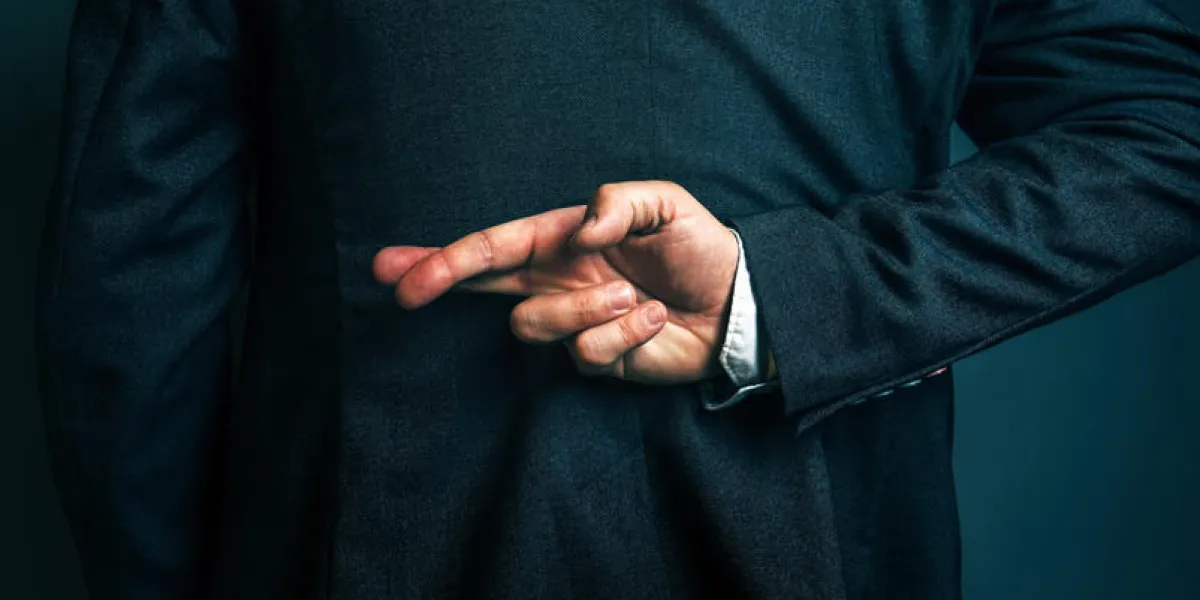dishonest businessman telling lies, lying businessperson holding fingers crossed behind his back