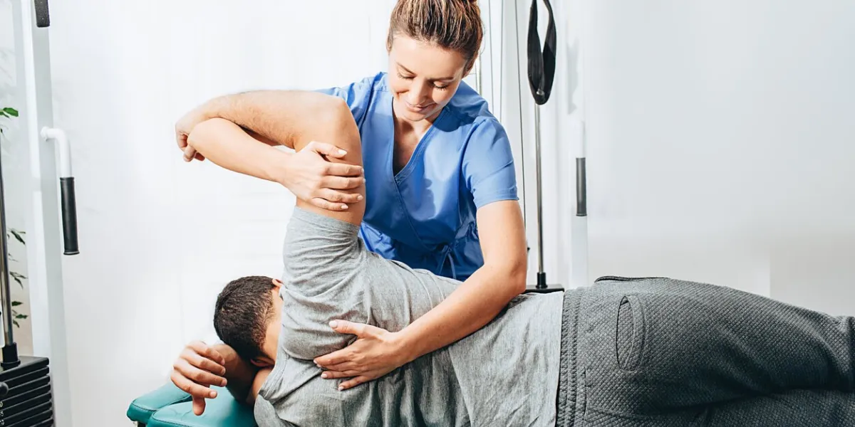 physiotherapist treatment patient she holding patient's hand, shoulder joint treatment