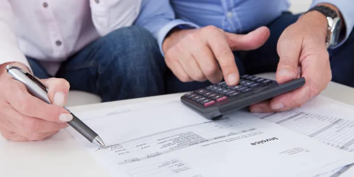 close-up of mature couple doing finances at home