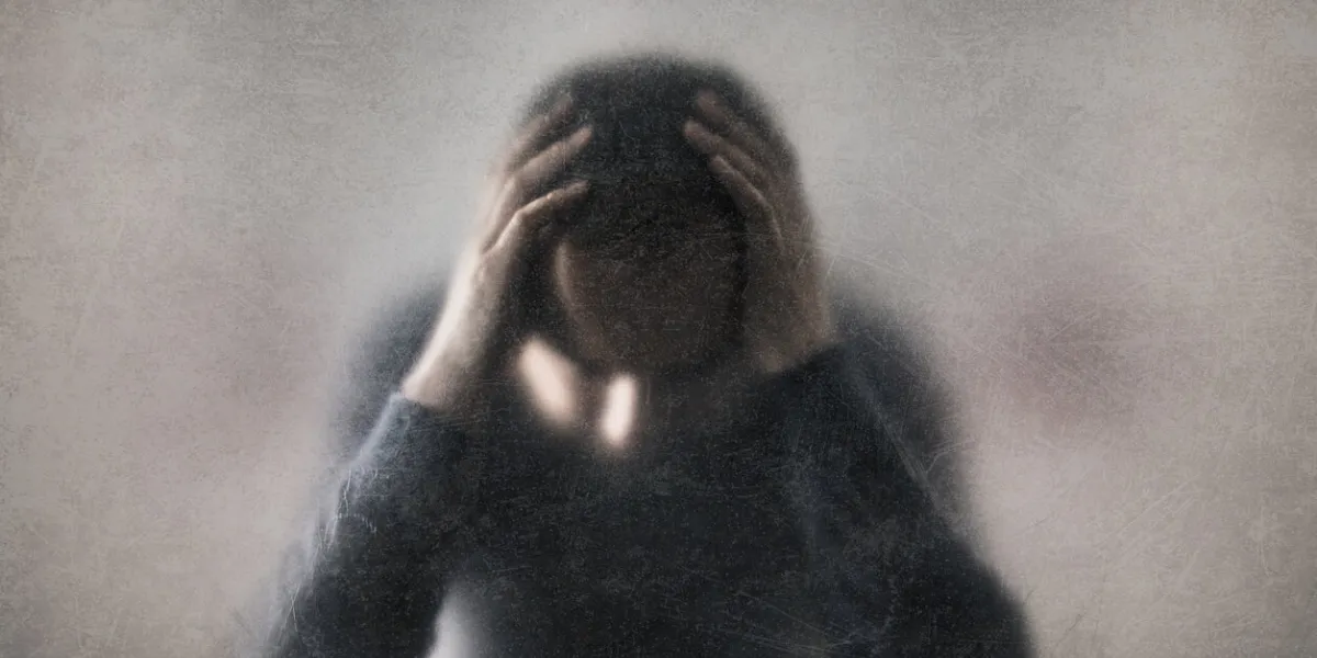 depression broken man behind a dusty scratched glass