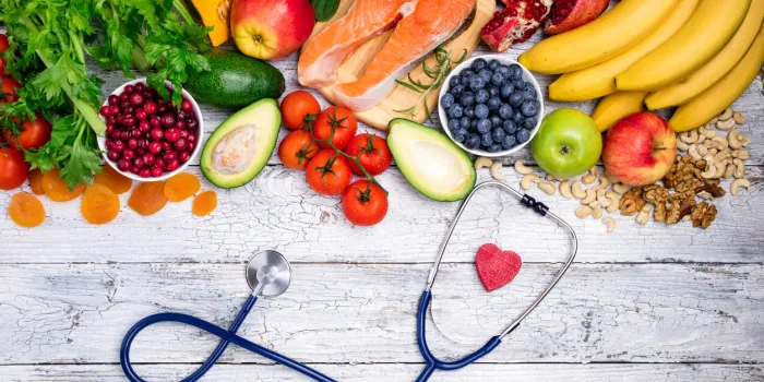 healthy food for heart fresh fish, fruits, vegetables, berries and nuts healthy food, diet and healthy heart concept top view