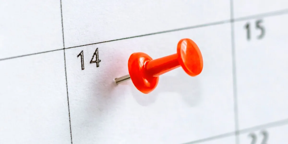 pin on calendar with date 14 fourteenth day of month with red thumbtack save the date concept st valentines day
