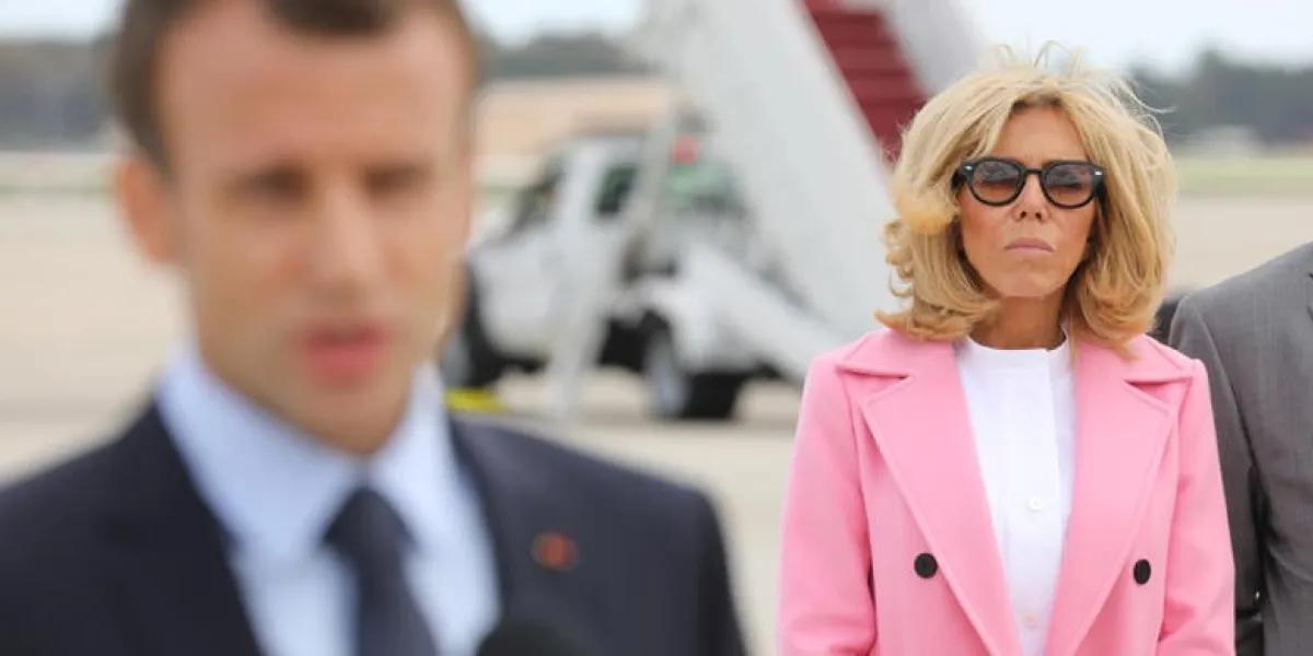 french president emmanuel macron speaks to the media at joint base andrews in maryland on april 23, 2018 as he wife brigitte macron lookspresident macron is in the us on a three-day state visit   afp photo   ludovic marin