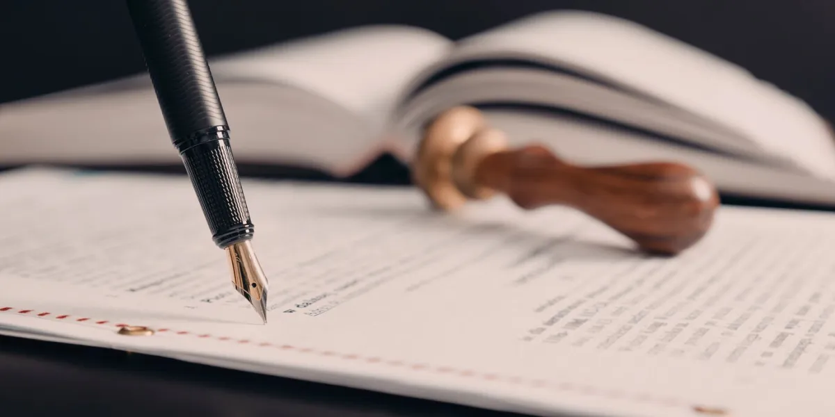 agreement concept with fountain pen and documents notary public, attorney, law close up composition